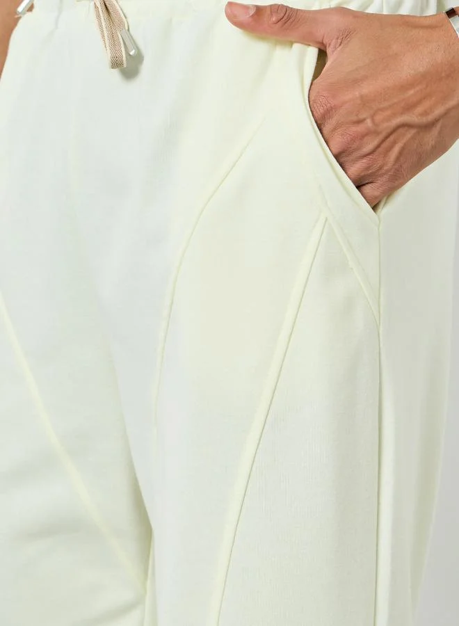 Styli Men Cream Solid Relaxed Fit Joggers